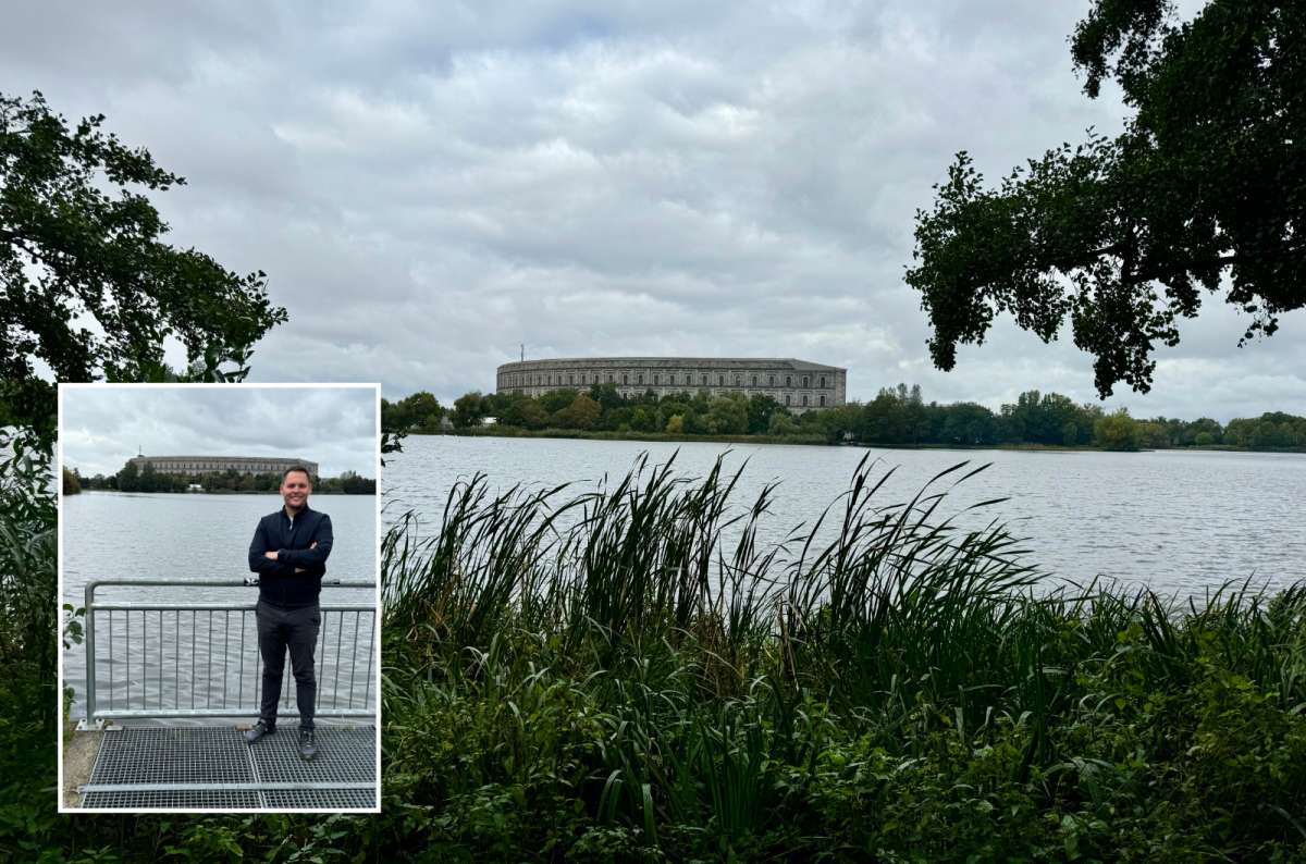 a photo of a tourist posing in front of the Nazi rally grounds when visiting Nuremberg, Germany, photo by Next Level of Travel