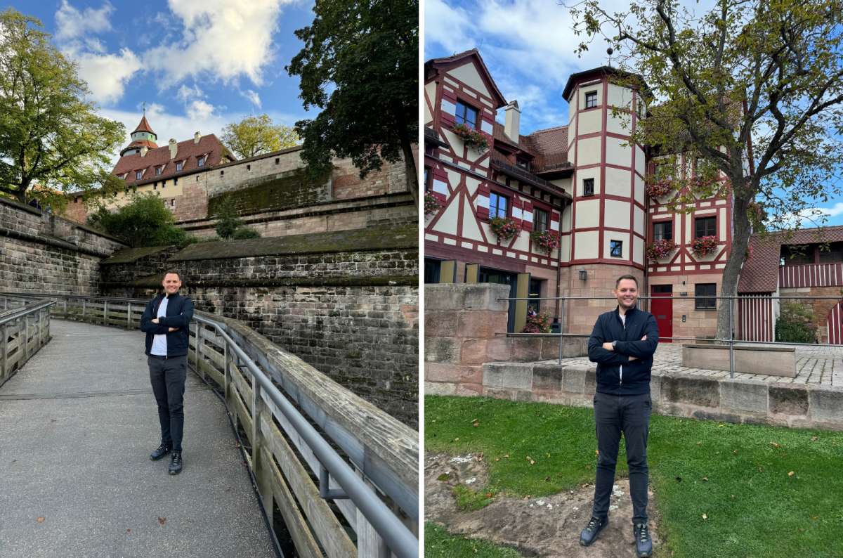 a tourist posing in front of one of the stops of a one day Nuremberg itinerary, the Nuremberg 