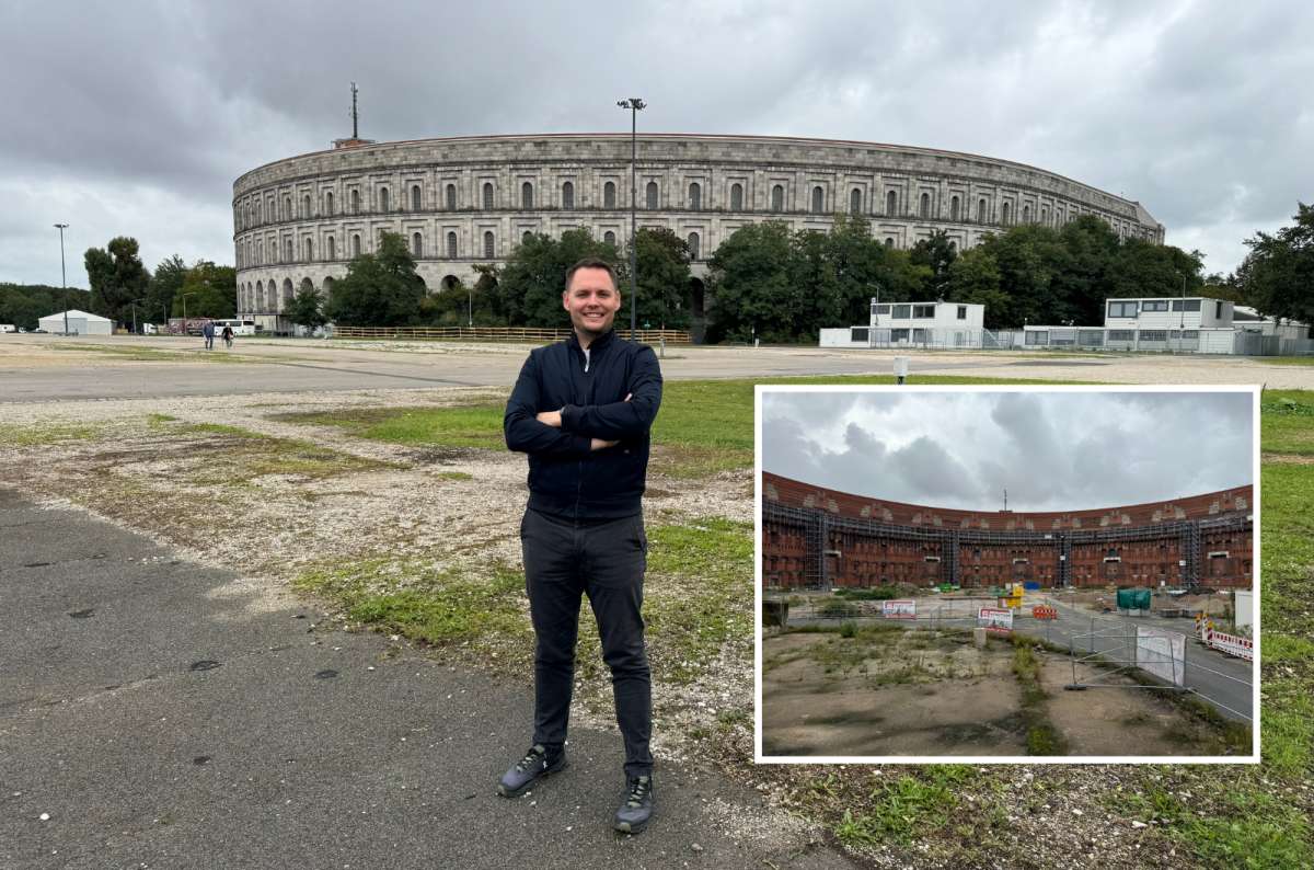 a tourist standing in front of the Nazi Party Rally Grounds with a smaller photo from the inside, photo by Next Level of Travel 