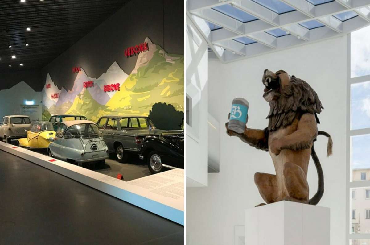 Exhibit from the House of Bavarian History showing vintage microcars on the left and a large statue of a lion holding a beer stein on the right, Regensburg, Germany