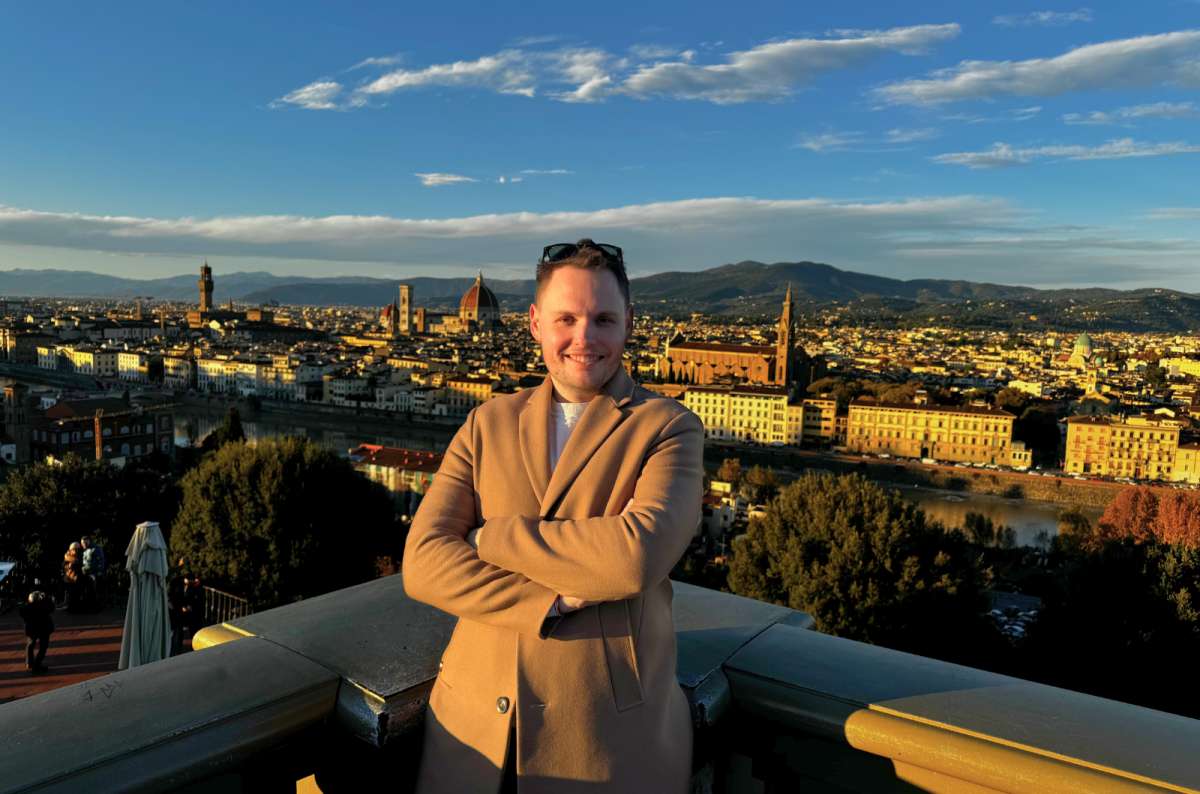 A tourist posing in front of the Florence panorama, Italy, photo by Next Level of Travel