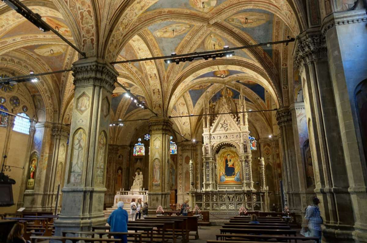 Interior of Orsanmichele Church, Florence, Italy, with painted vaults and ornate altar
