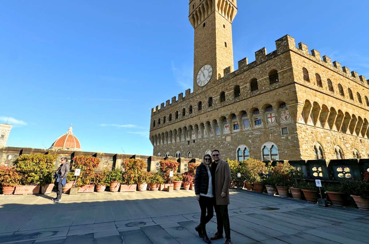 Tourists on the terrace of Palazzo Vecchio with a view of the Florence Cathedral dome in Florence, Italy, photo by Next Level of Travel