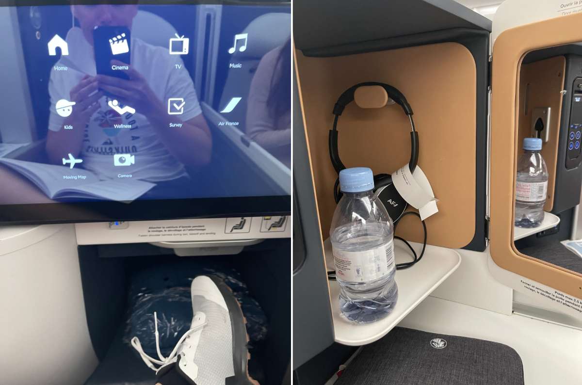 Air France business class seat with personal screen, storage compartment with water bottle and headphones, and extended legroom, photo by Next Level of Travel