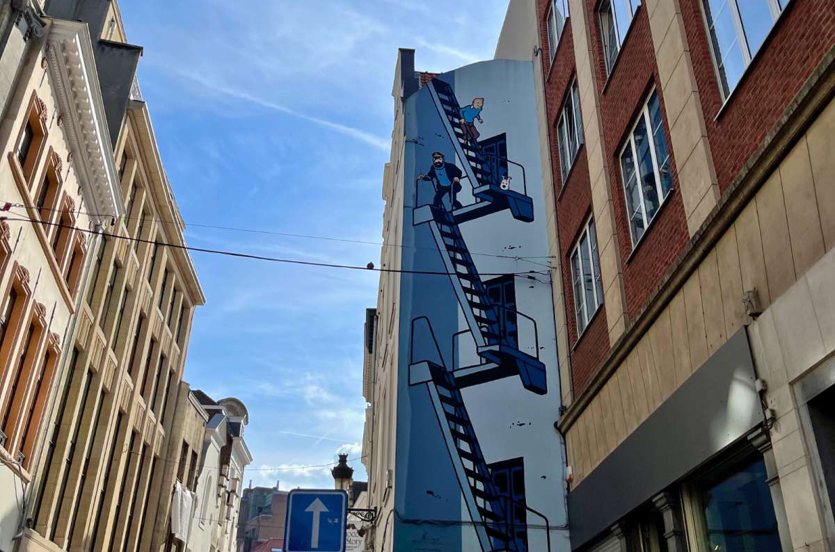 Mural of Tintin, Captain Haddock, and Snowy on a staircase in Brussels, Belgium, photo by Next Level of Travel