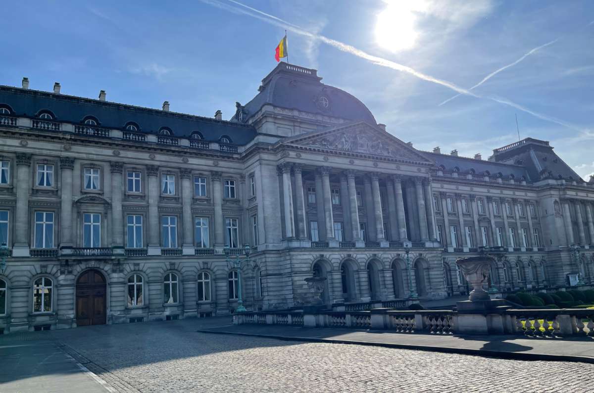 Royal Palace of Brussels with the Belgian flag flying on top, photo by Next Level of Travel