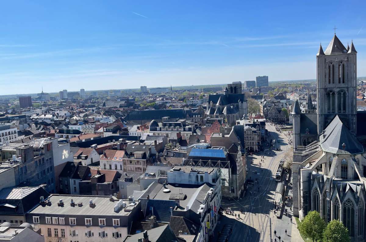 a photo of Ghent from up above showing the pedestrian nature of the city with St. Nicholas Church in frame, Ghent, Belgium, photo by Next Level of Travel