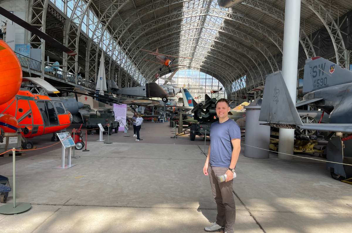 Inside the Royal Museum of the Armed Forces and Military History in Brussels, Belgium, with aircraft and military vehicles on display, photo by Next Level of Travel