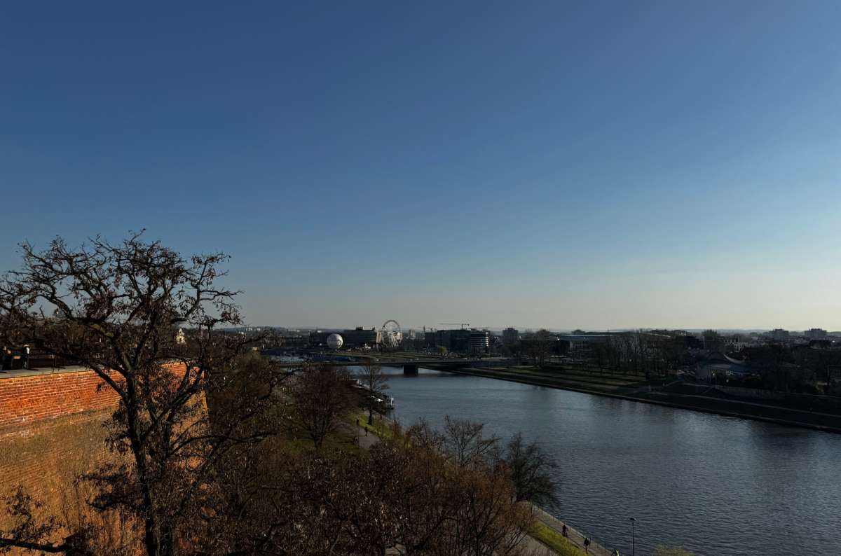 a photo of the view of the Vistula River during a lovely sunset, Krakow, Poland, photo by Next Level of Travel