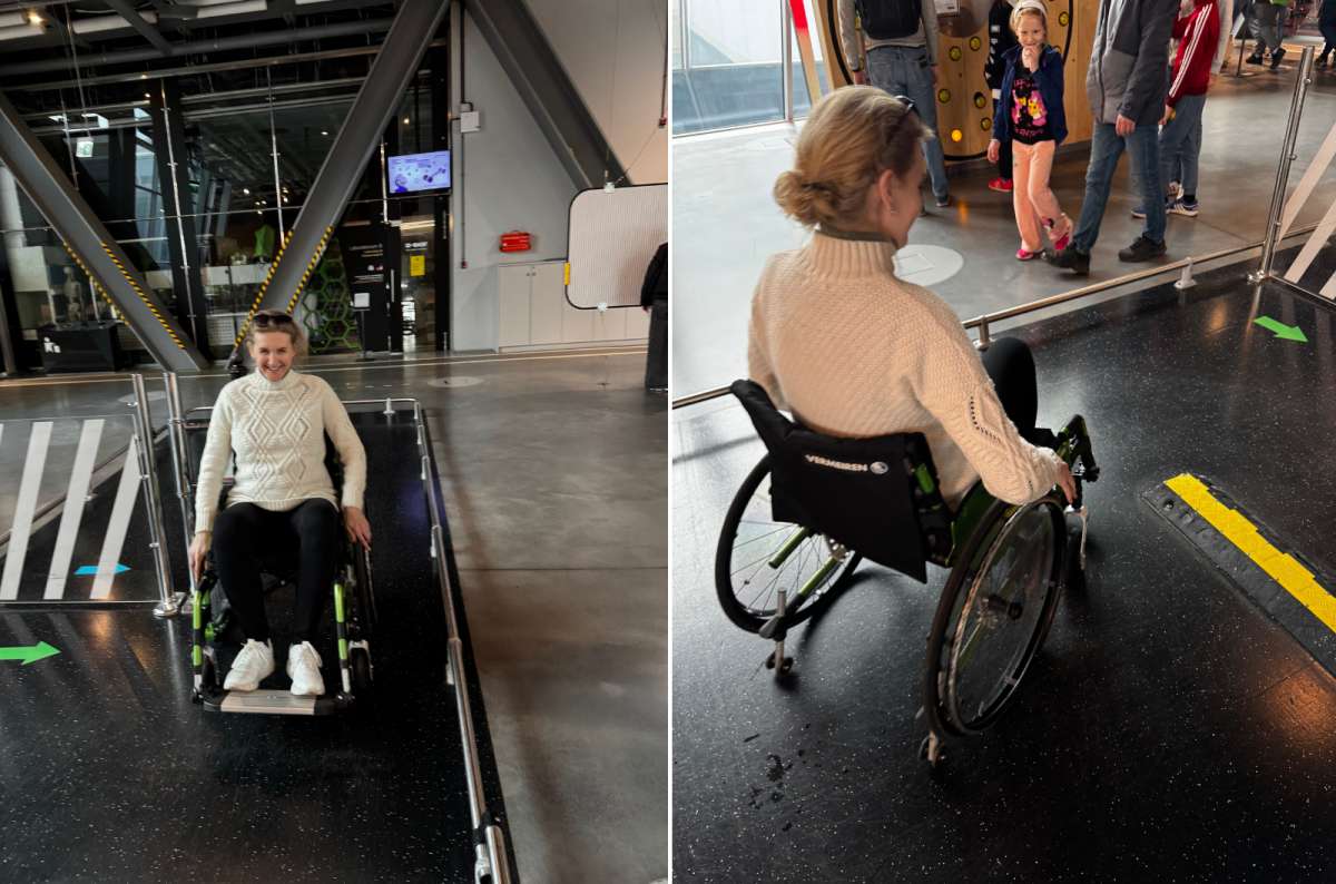 Visitor testing an interactive wheelchair exhibit at the Copernicus Science Centre in Warsaw, Poland, designed to simulate accessibility challenges, photo by Next Level of Travel