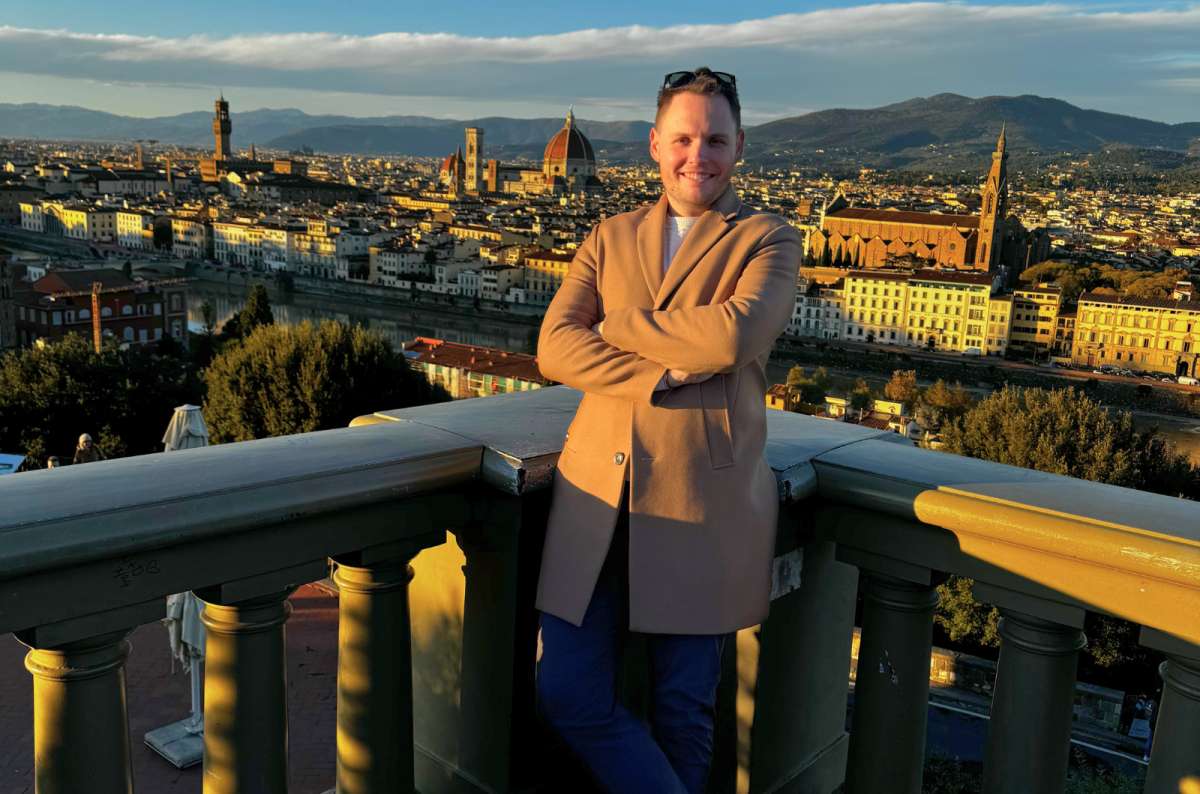 View of Florence, Italy, from Piazzale Michelangelo at sunset with the Florence Cathedral (Duomo di Firenze) and Palazzo Vecchio in the background, photo by Next Level of Travel