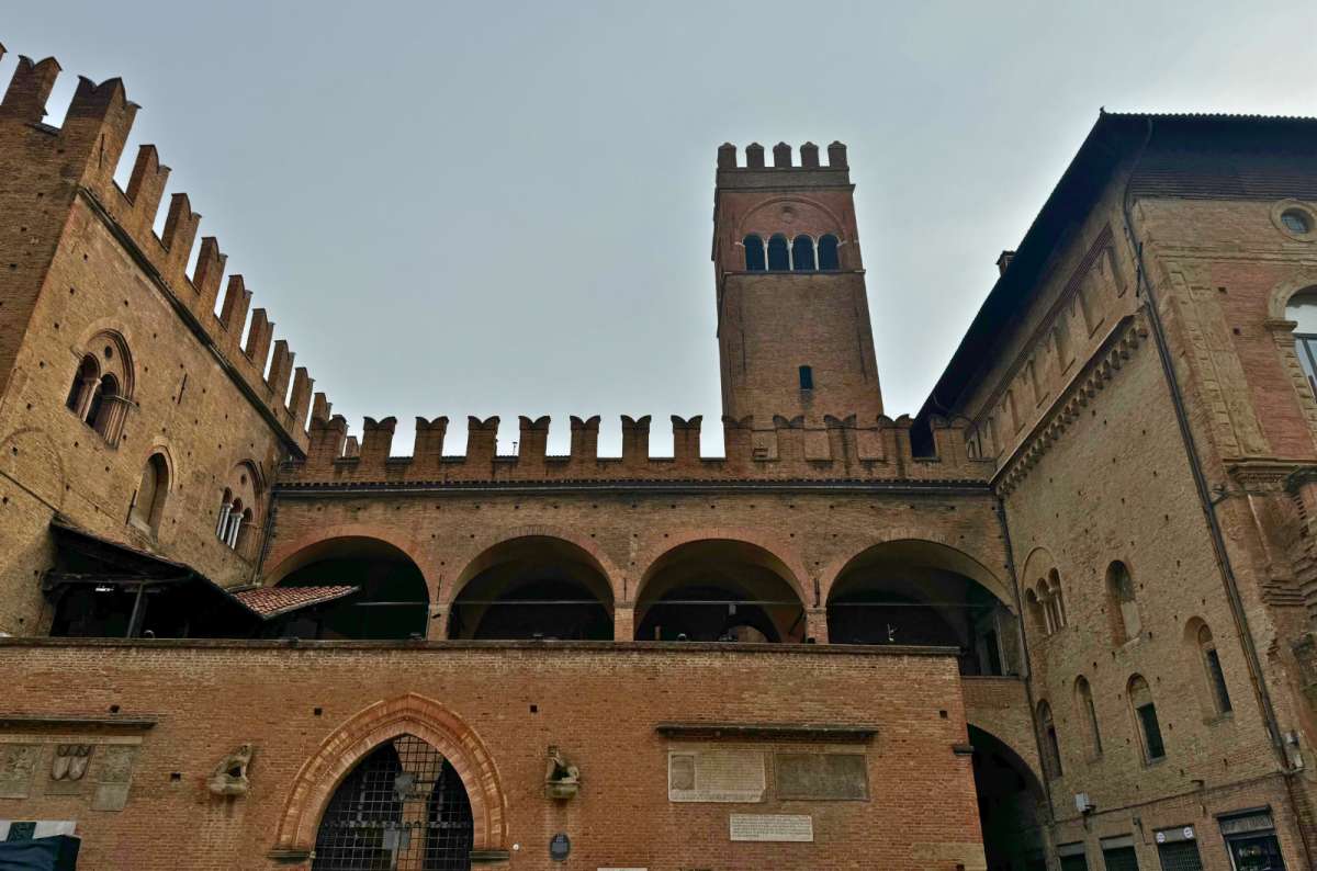 Palazzo Re Enzo in Bologna, Italy, a medieval brick palace, one of the landmarks worth visiting in Bologna, photo by Next Level of Travel