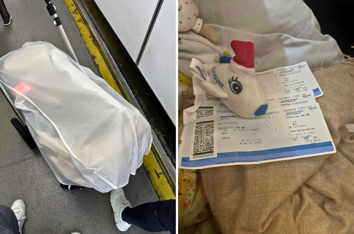 Baby stroller prepared for boarding and Discover Airlines Business Class boarding passes, photo by Next Level of Travel