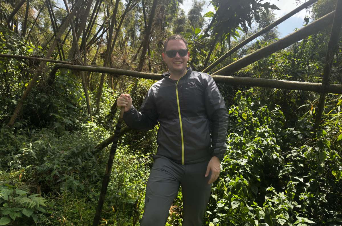 Tourist posing in the Volcanoes National Park during hiking, Rwanda, photo by Next Level of Travel