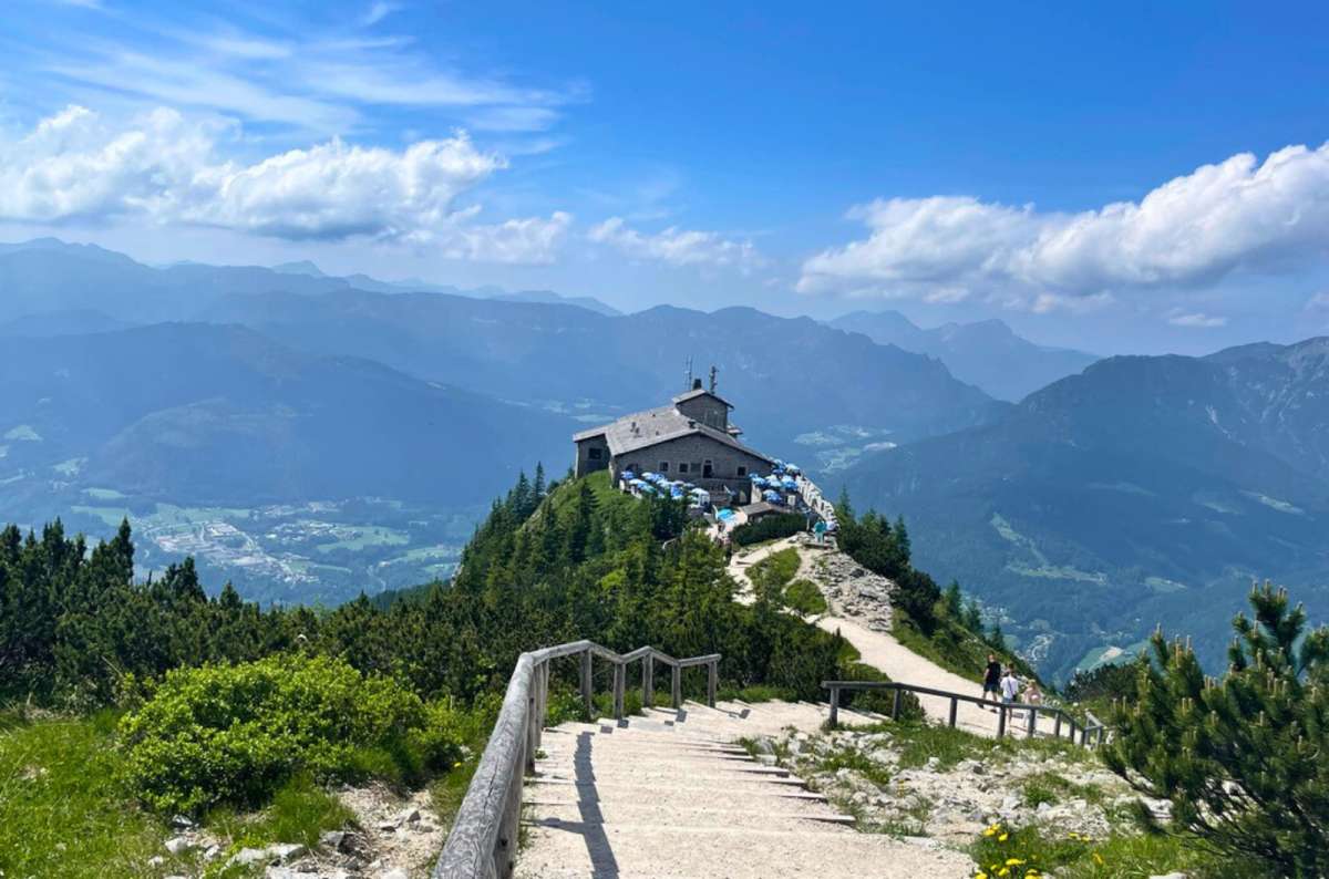 Eagle’s Nest mountain viewpoint above Berchtesgaden, Germany, with a hiking path leading to the historic building and panoramic Alpine views, photo by Next Level of Travel