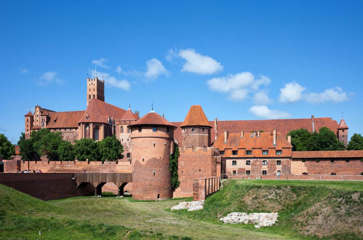 Malbork Castle complex with red brick towers and fortified walls, Malbork, Poland