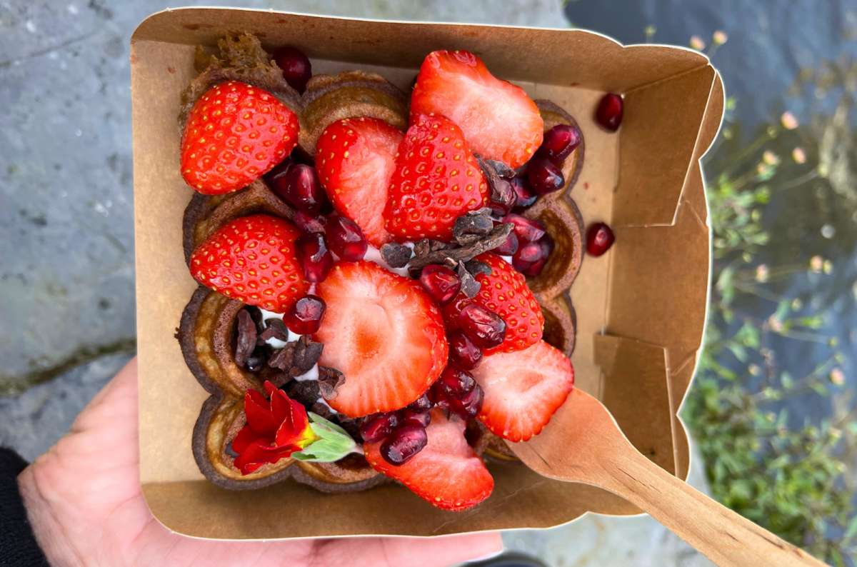 Sweet Belgian waffle topped with fresh strawberries and pomegranate seeds, Belgium, photo by Next Level of Travel