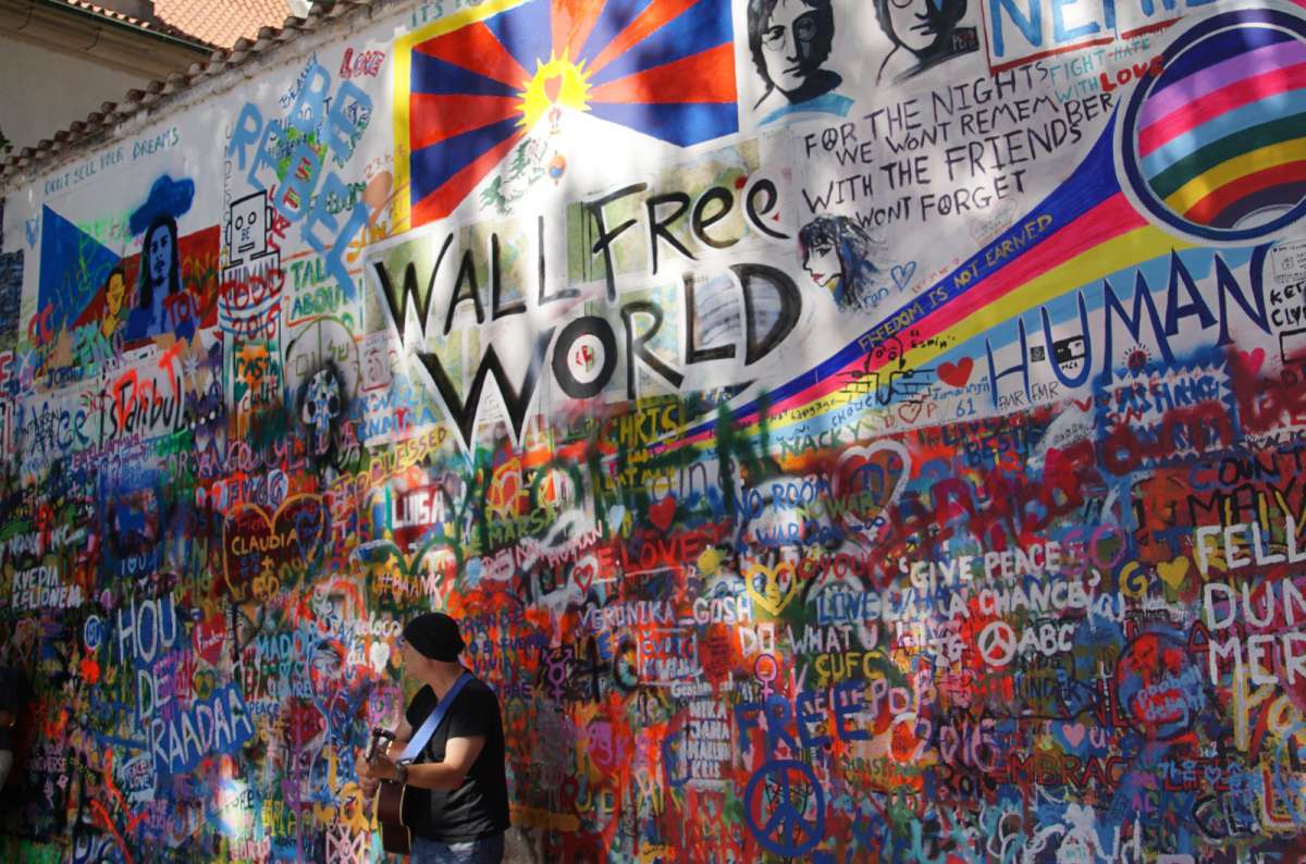 Colorful graffiti and messages on the Lennon Wall in Prague, Czech Republic