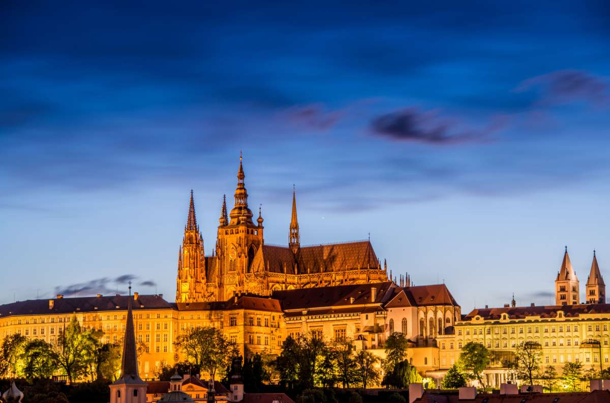Prague Castle and St. Vitus Cathedral illuminated at night in Prague, Czech Republic, photo by Next Level of Travel