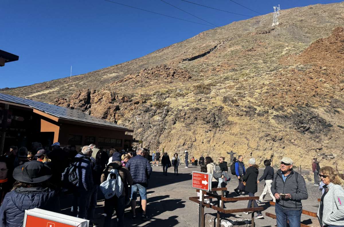 a photo from the base of Mt. Teide with crowds gathering under the mountain, Canary Islands, photo by Next Level of Travel