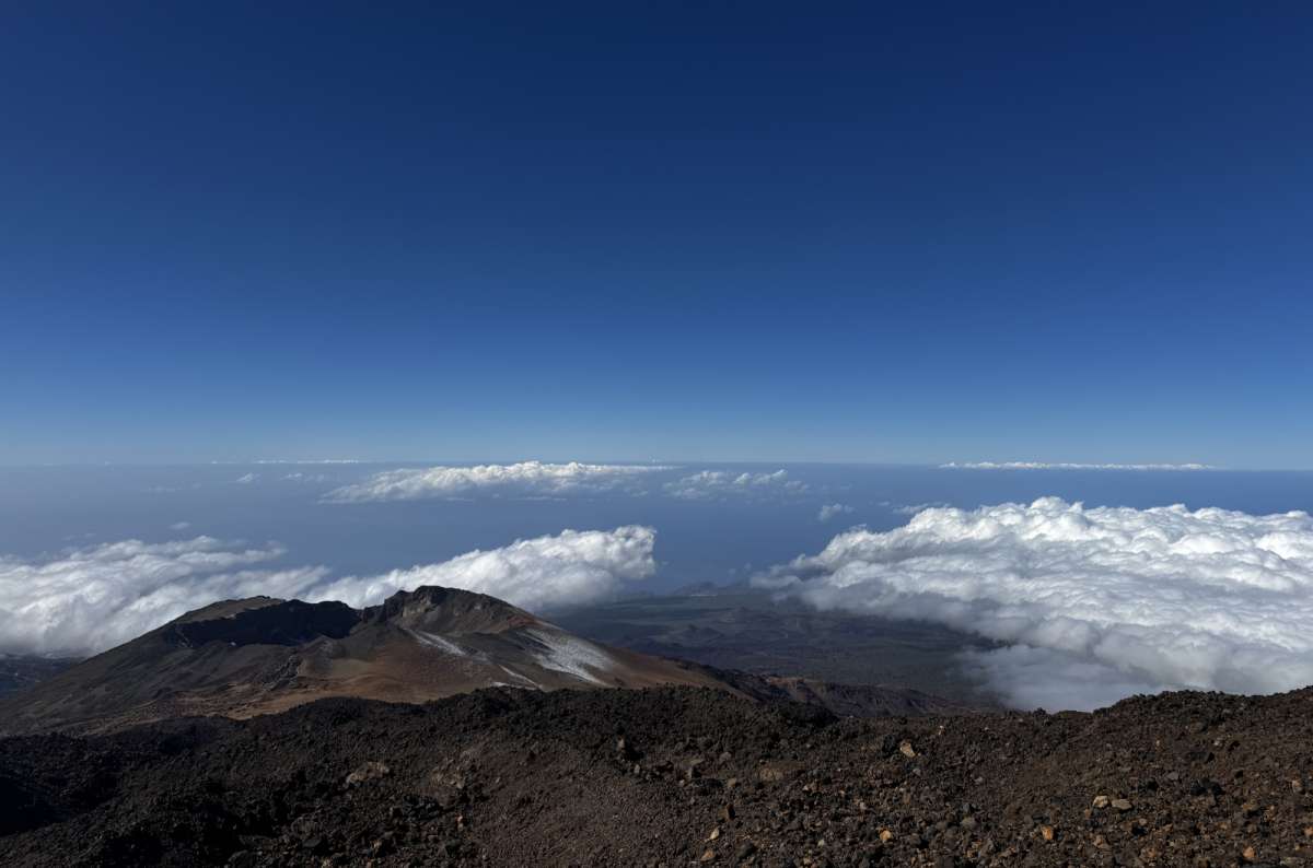 a photo from the peak of Mt. Teide showing the view down below, Canary Islands, photo by Next Level of Travel