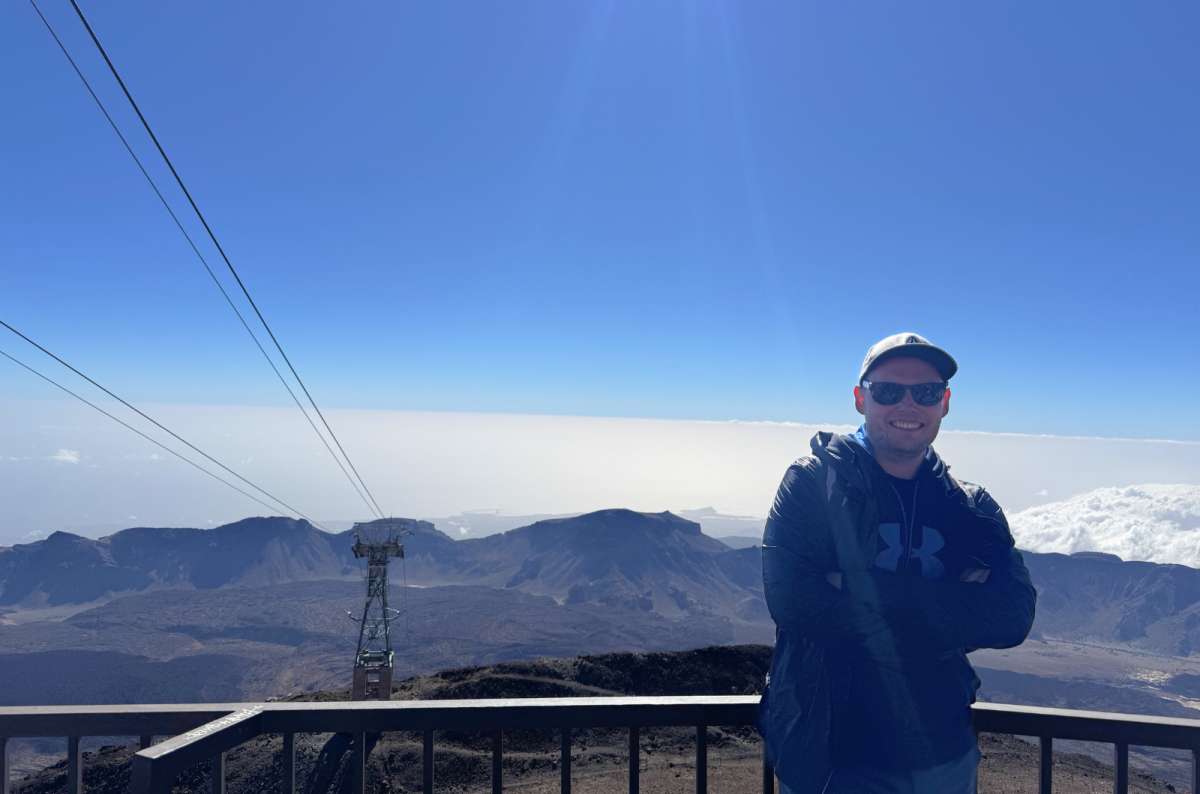 a photo of a tourist posing at the summit of Mt. Teide, Canary Islands, photo by Next Level of Travel