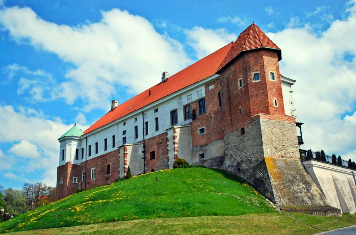 Sandomierz Castle on a hill with red roof and brick walls, Sandomierz, Poland