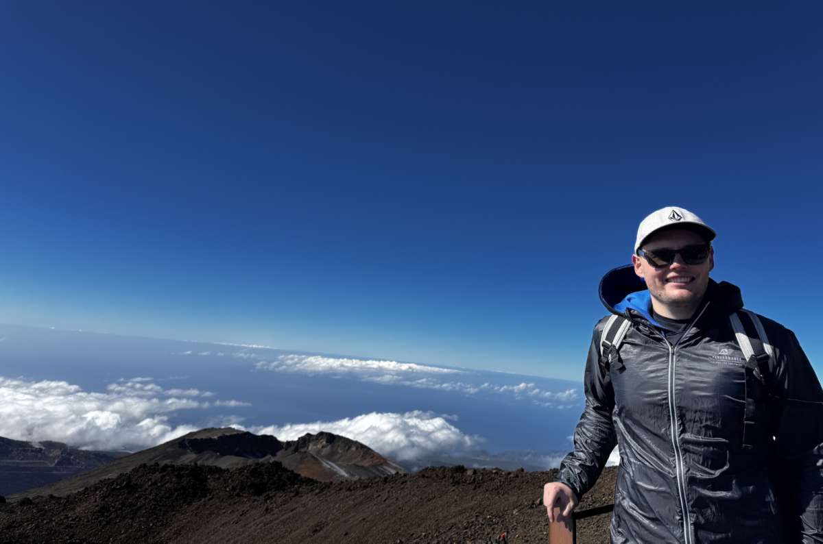 View from Mount Teide volcano overlooking volcanic terrain and cloud layer, Tenerife, Canary Islands, photo by Next Level of Travel