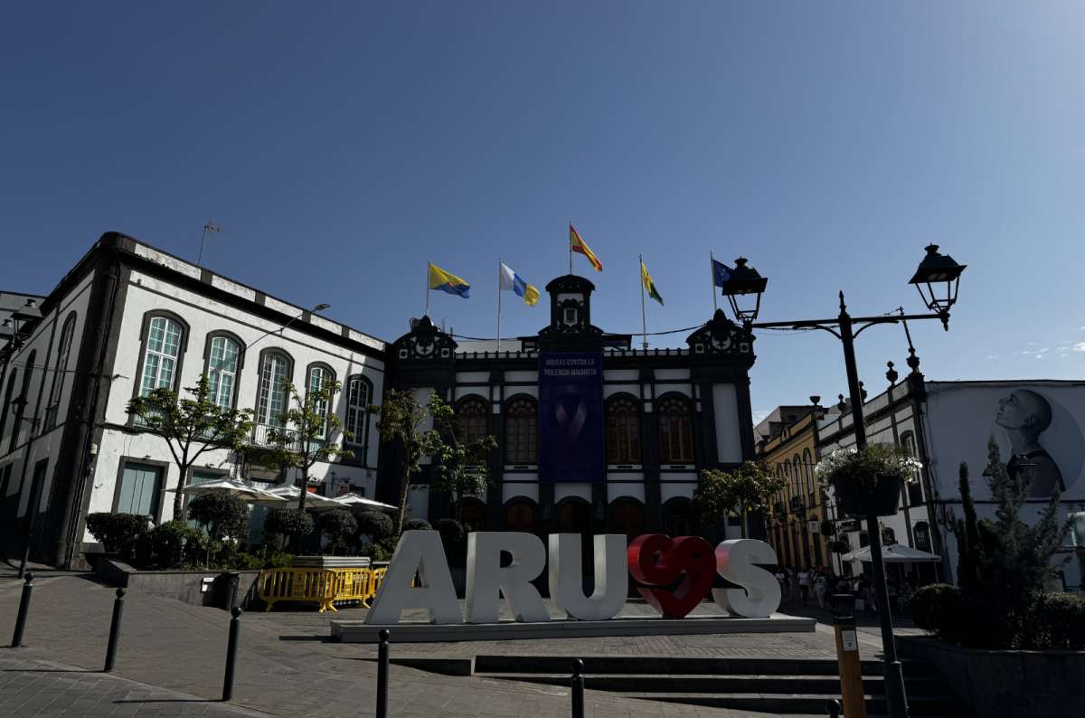 a photo from Arucas showing a sign in the city square saying the name of the city with a heart shape in it, Gran Canaria, Canary Islands, photo by Next Level of Travel