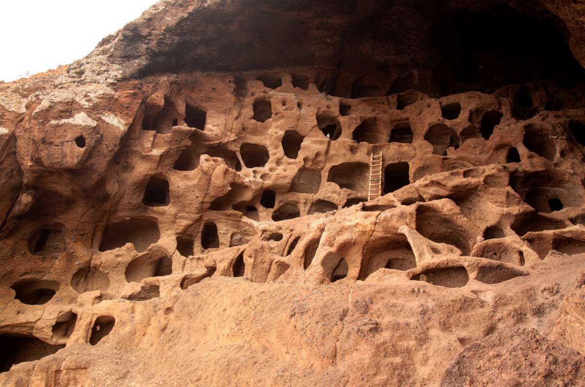 a photo of Cenobio de Valeron showing all the entrances to the storage caves, Gran Canaria, Canary Islands