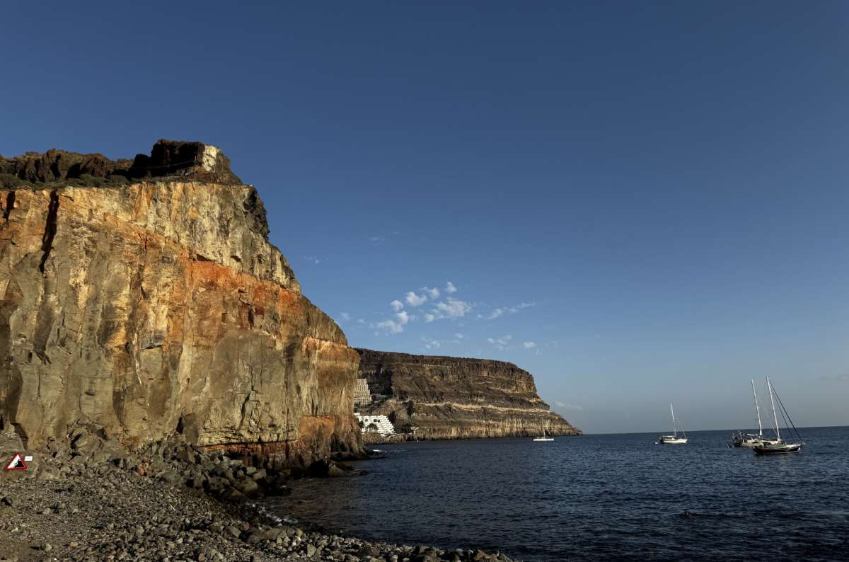 a photo of Puerto de Mogán, showing the beautiful cliffs and deep blue water, Gran Canaria, Canary Islands, photo by Next Level of Travel