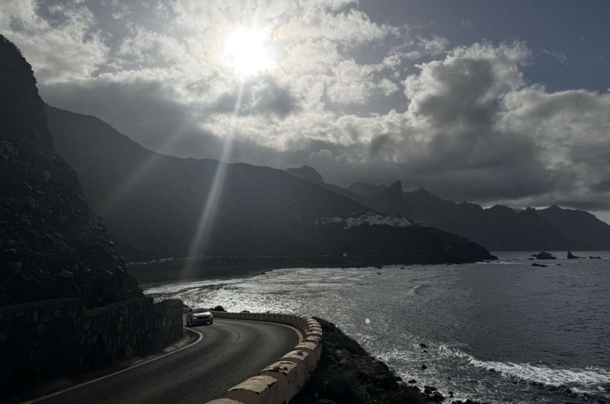 a photo of a road along the coast with waves hitting the cliffs in the background, Canary Islands, photo by Next Level of Travel