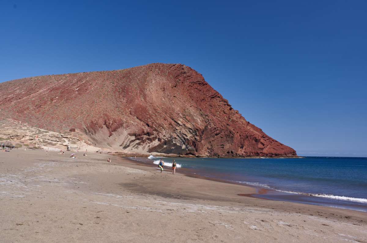a photo of Montaña Roja and the sea right next to it, Canary Islands