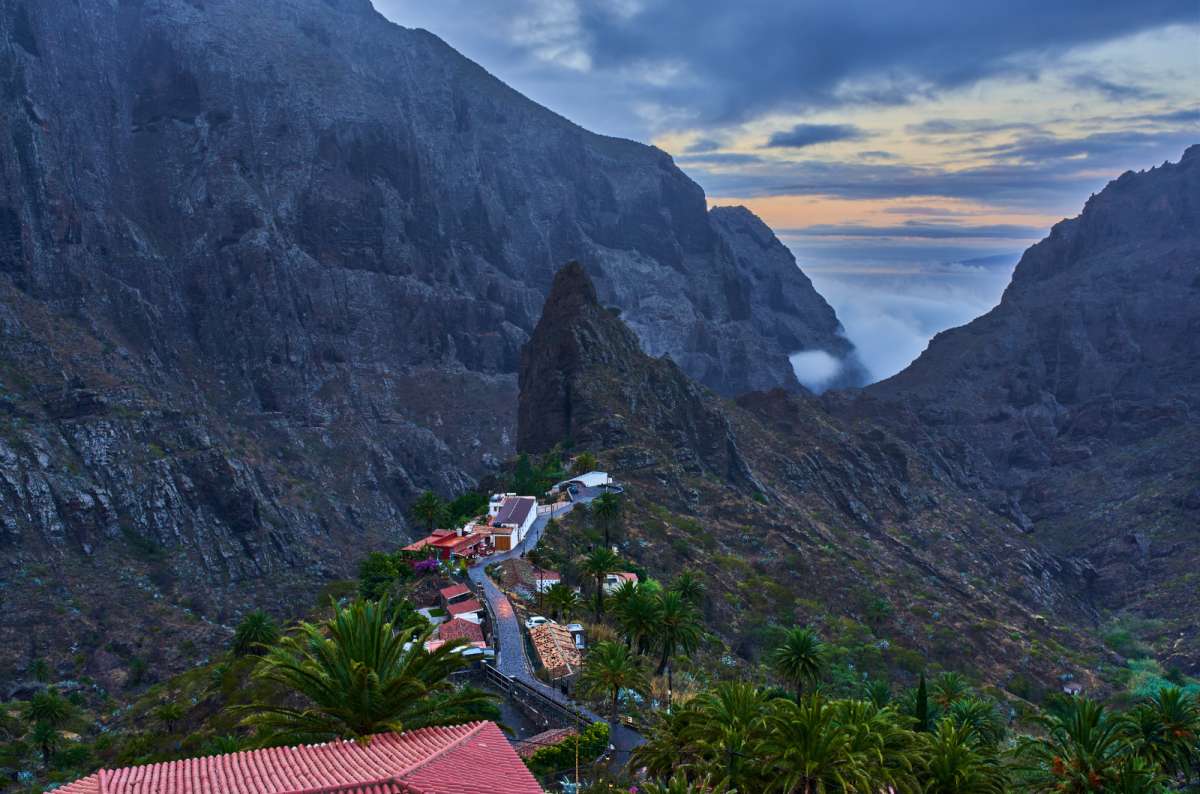 a photo of the Masca village surrounded by cliffs and the valley down below, Canary Islands