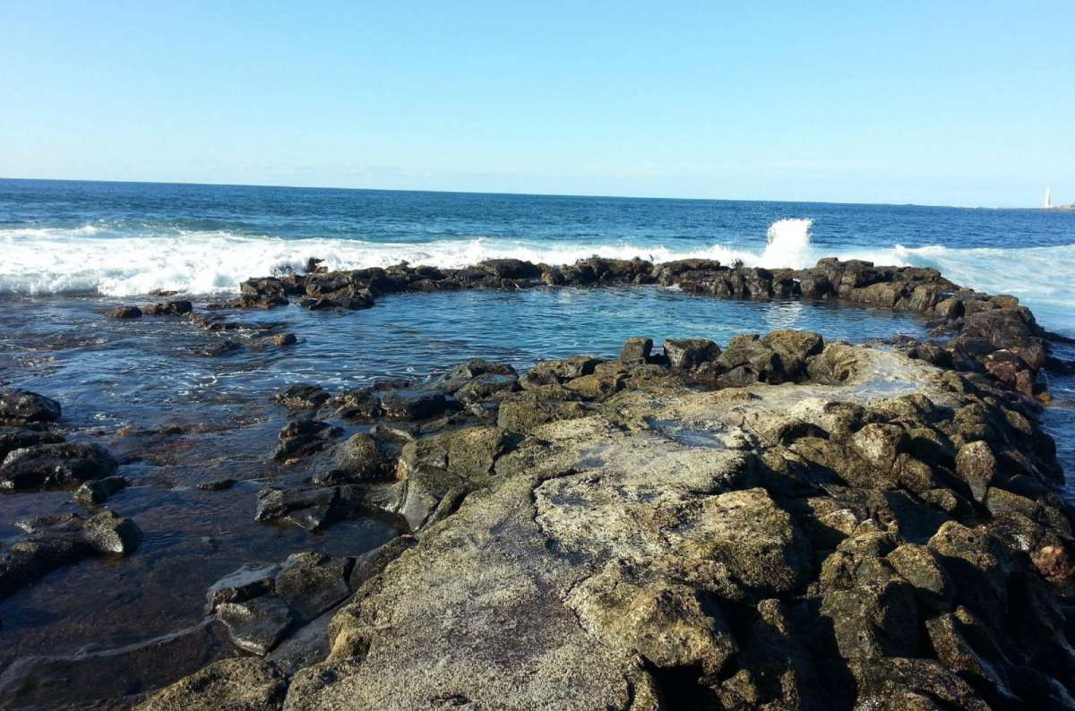a photo of the Natural pools in Northern Tenerife with the vast ocean visible in the background, Canary Islands