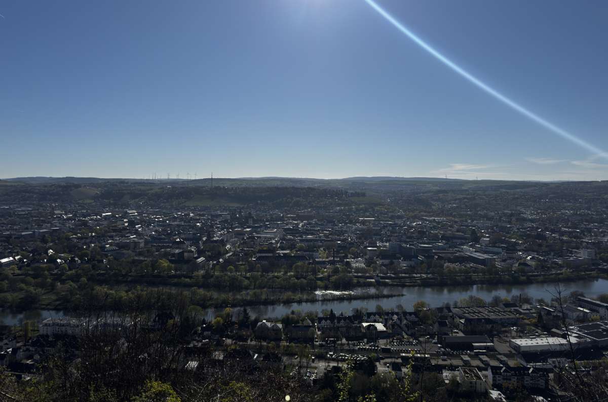 a photo of the view of Trier from a viewpoint up above, showing the river flowing through the city, Germany, photo by Next Level of Travel
