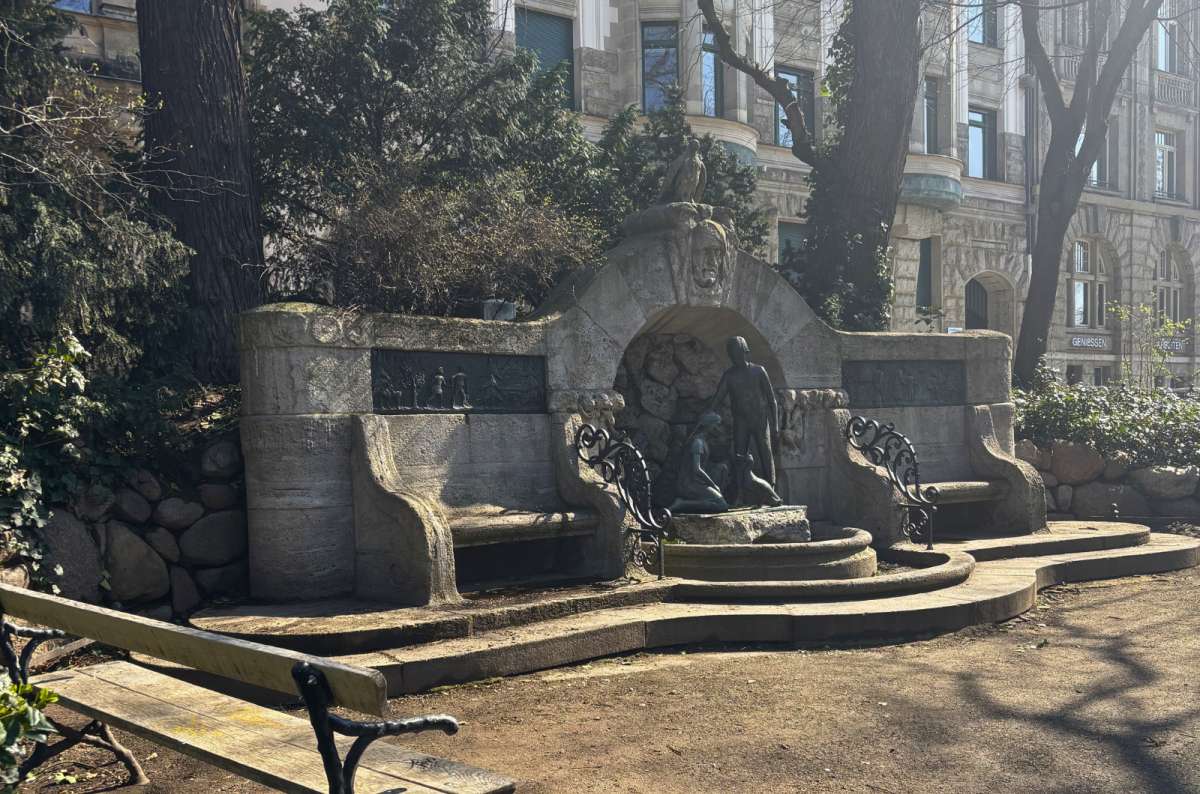 Historic fountain and stone benches in a quiet park near the city center in Leipzig, Germany, photo by Next Level of Travel