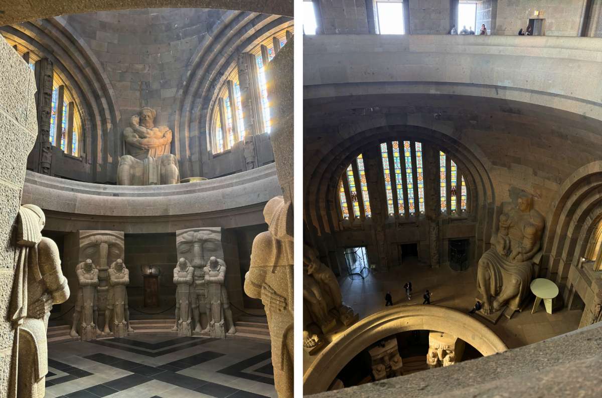 Interior of the Völkerschlachtdenkmal monument in Leipzig, Germany, with massive stone statues and vaulted architecture, photo by Next Level of Travel