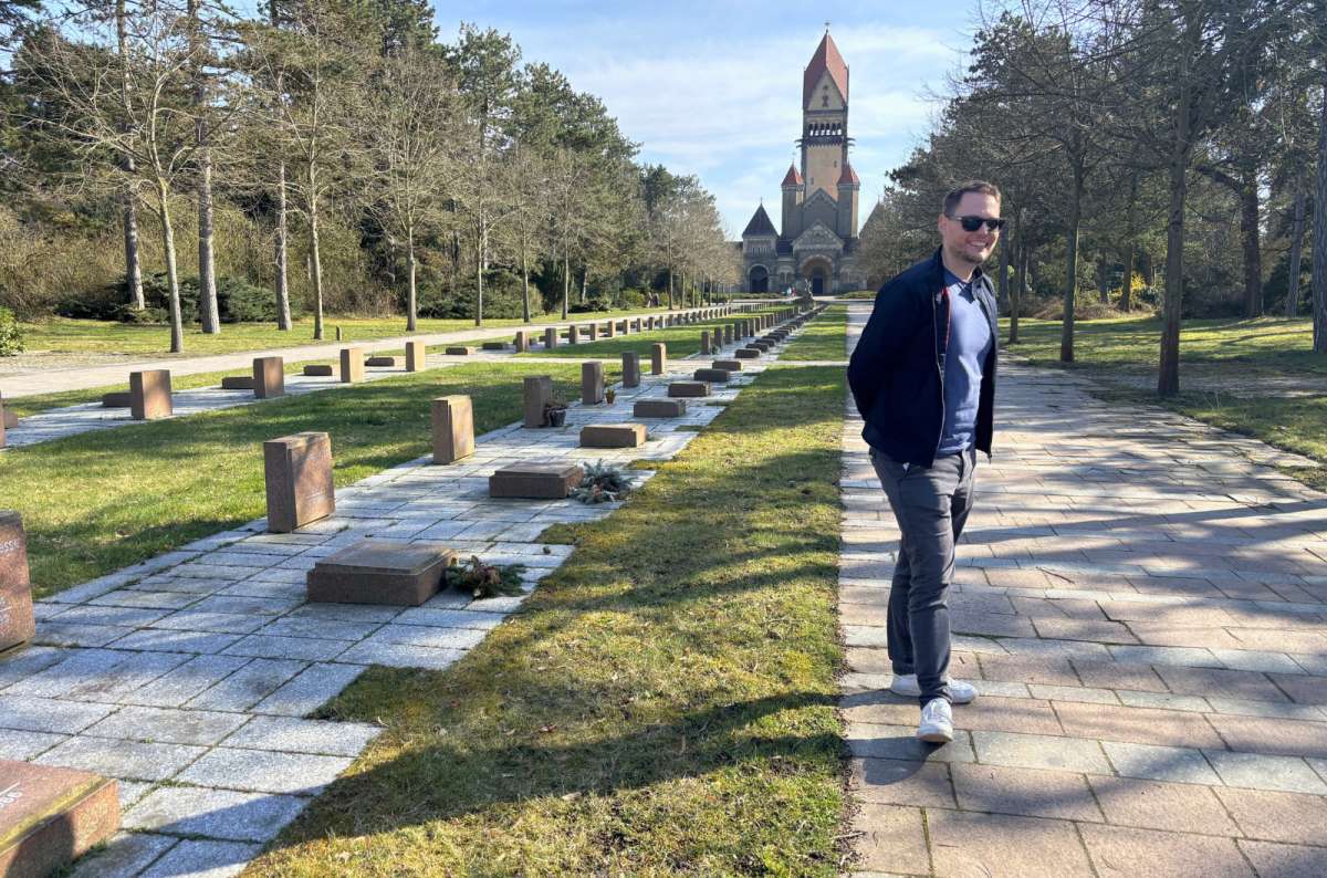 Tourist walking through Südfriedhof Mahnmal cemetery near the Battle of the Nations Memorial in Leipzig, Germany, photo by Next Level of Travel