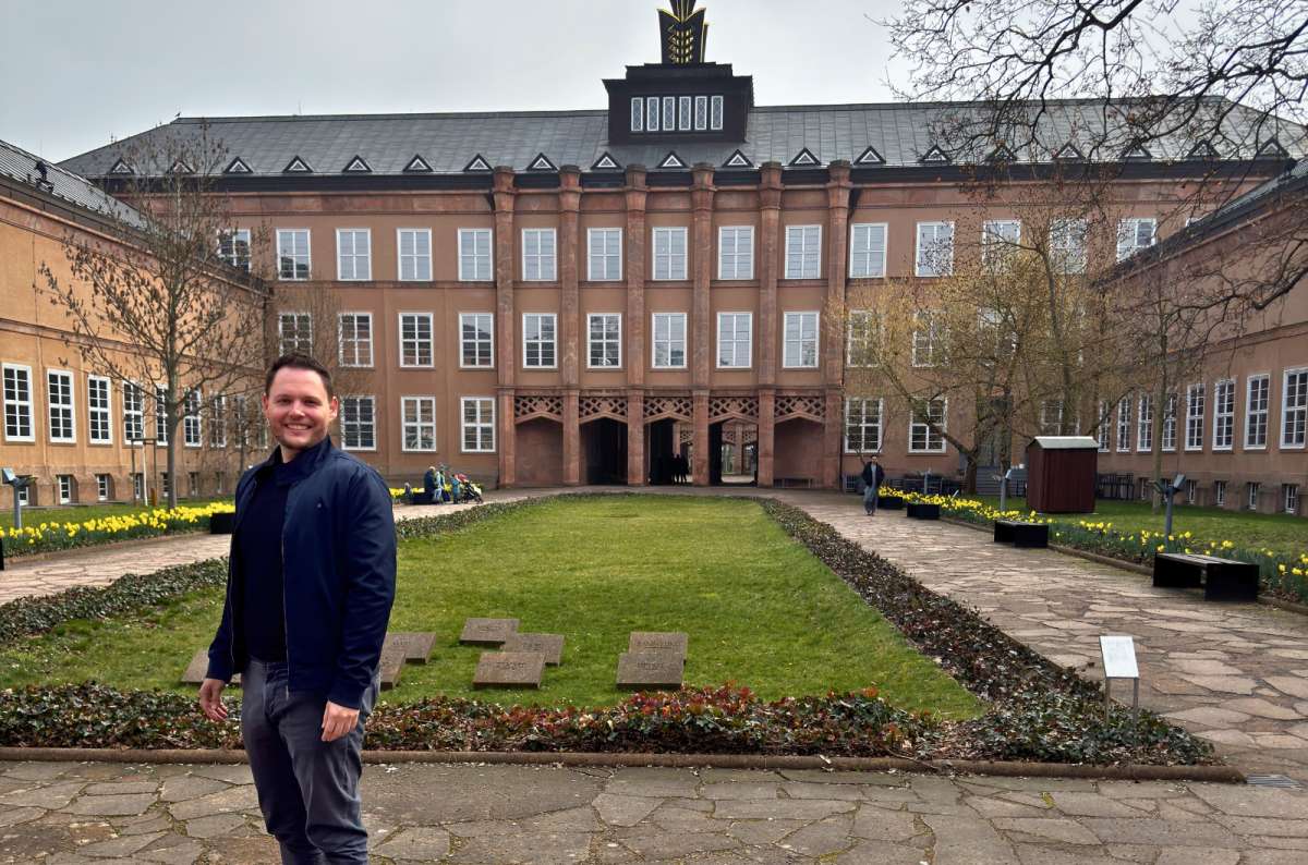 Traveler standing in the courtyard of the Grassi Museum complex in Leipzig, Germany, photo by Next Level of Travel