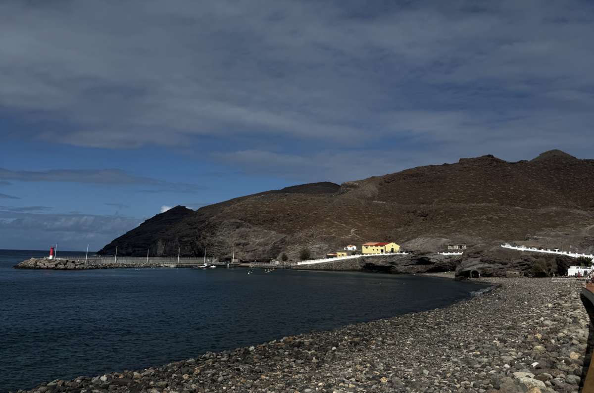 a photo from Aldea Beach showing the beautiful houses visible in the background, Canary Islands, photo by Next Level of Travel