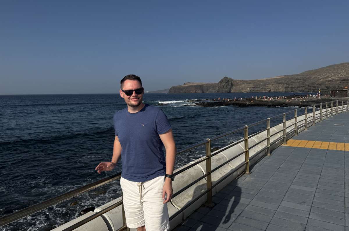 a photo of a tourist posing at the Agaete beach in Gran Canaria, Canary Islands, photo by Next Level of Travel