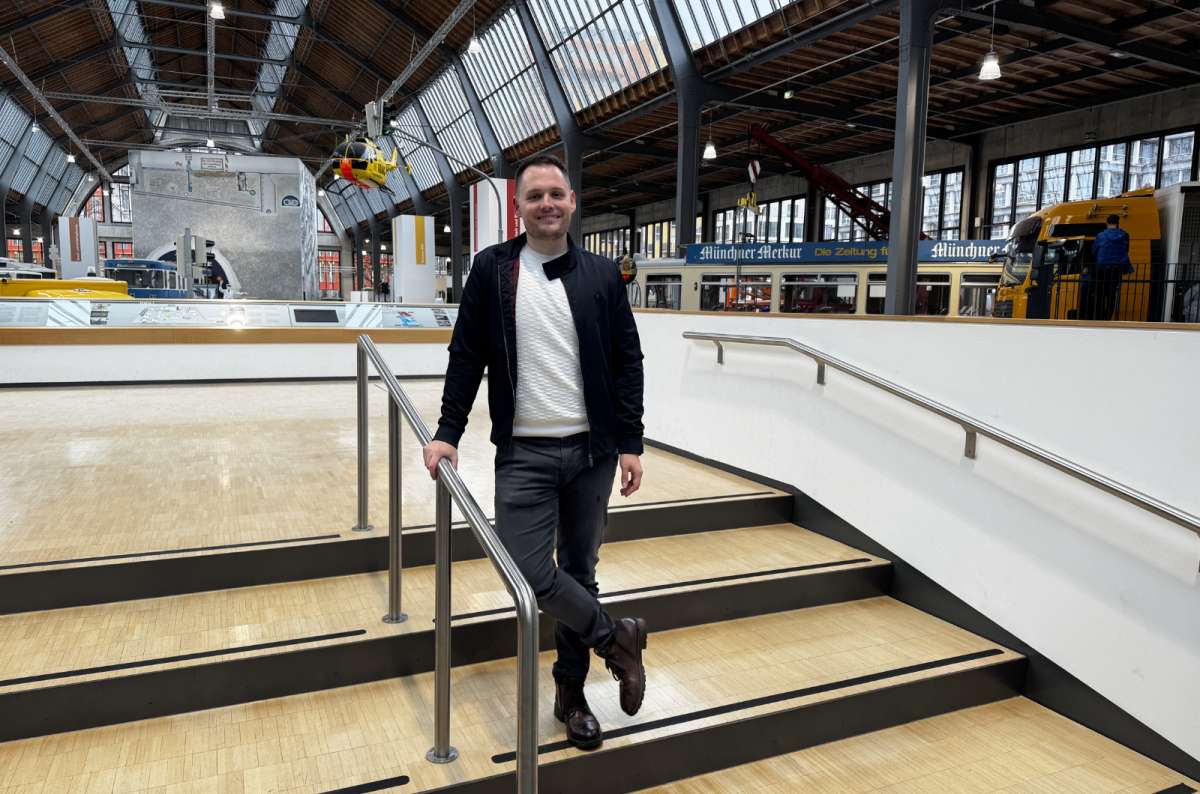 a photo of a tourist posing at the train station in Munich, Germany, photo by Next Level of Travel
