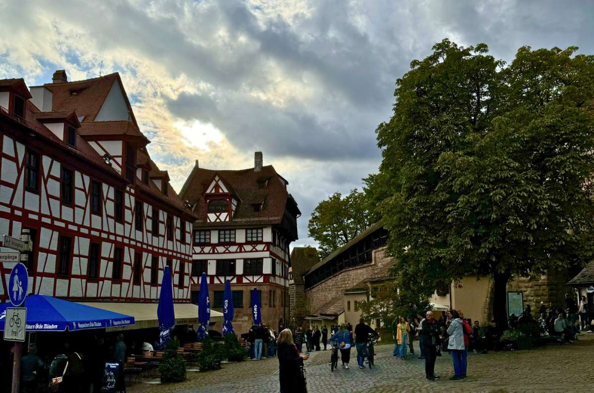 a photo of the typical street in the old town part of Nuremberg, with markets, Germany, photo by Next Level of Travel
