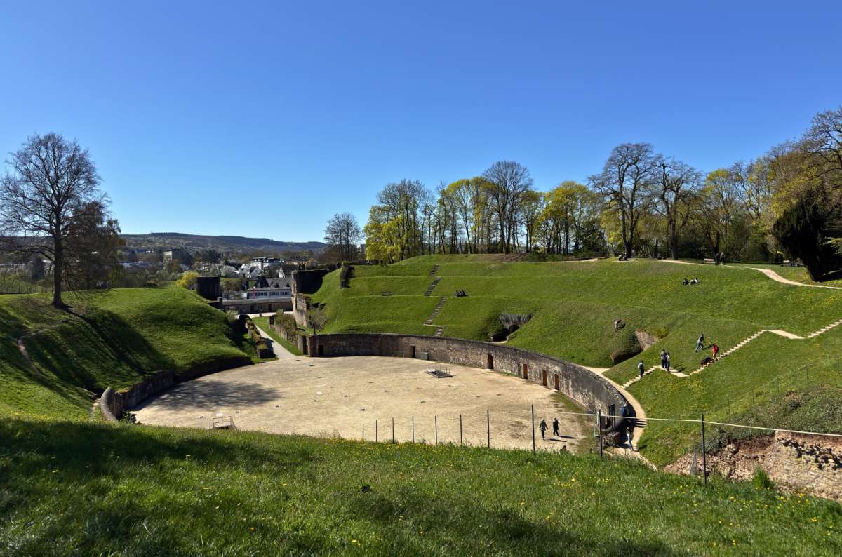 Roman Amphitheater in Trier surrounded by grassy hills in Trier, Germany, photo by Next Level of Travel