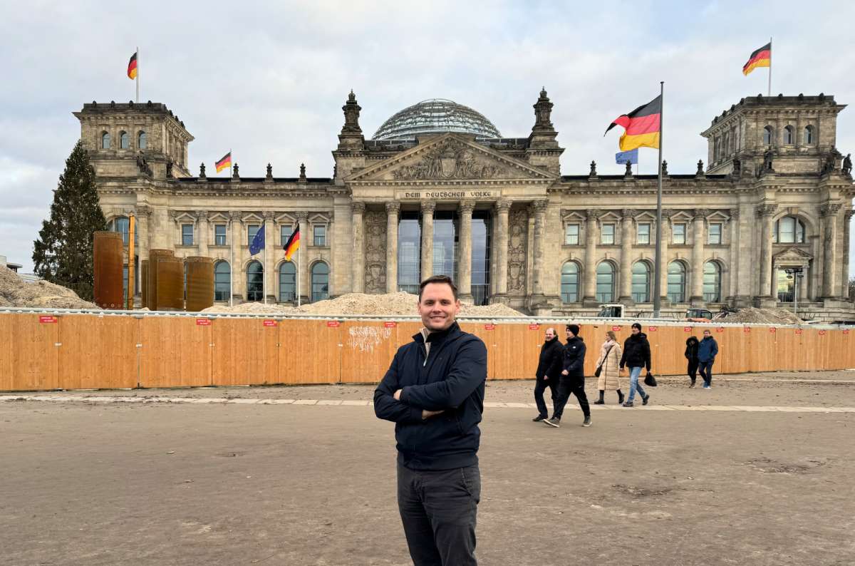 Tourist in front of the Reichstag Building in Berlin, Germany, photo by Next Level of Travel