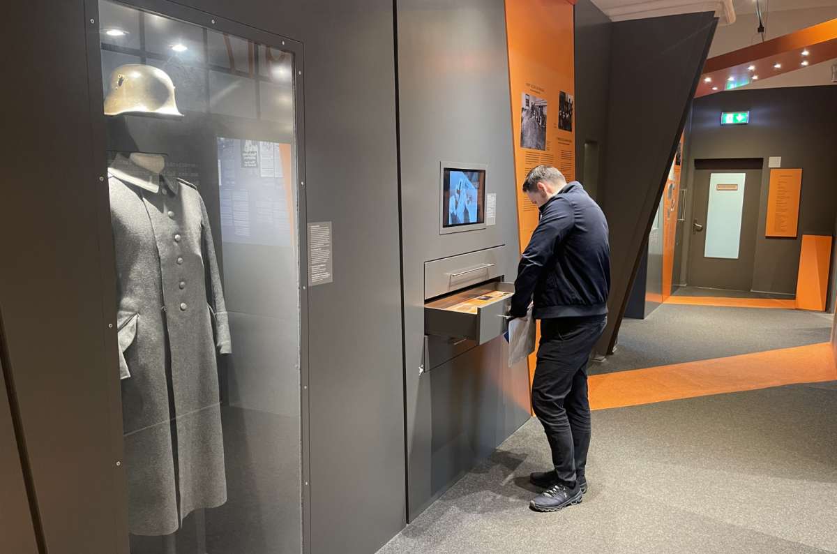 Tourist visiting the Topography of Terror museum in Berlin, Germany, photo by Next Level of Travel
