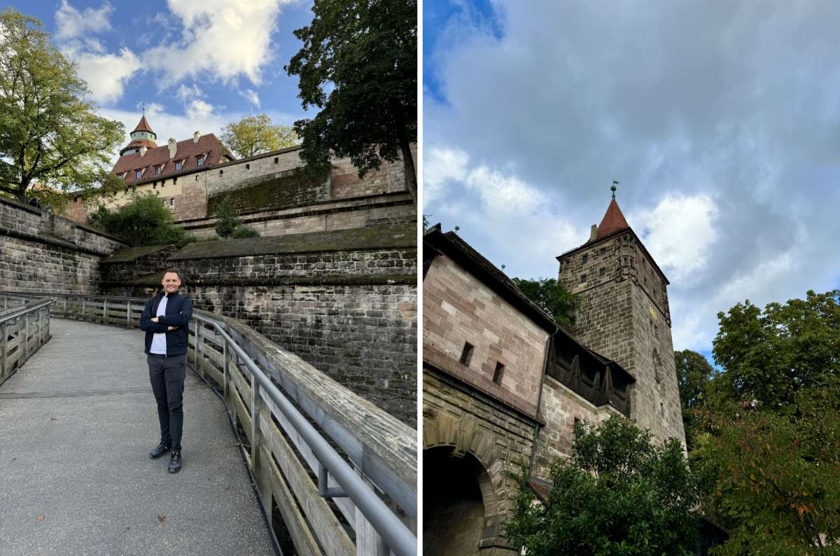 Tourist walking near the medieval city walls and towers of Nuremberg Castle in Nuremberg, Germany, photo by Next Level of Travel