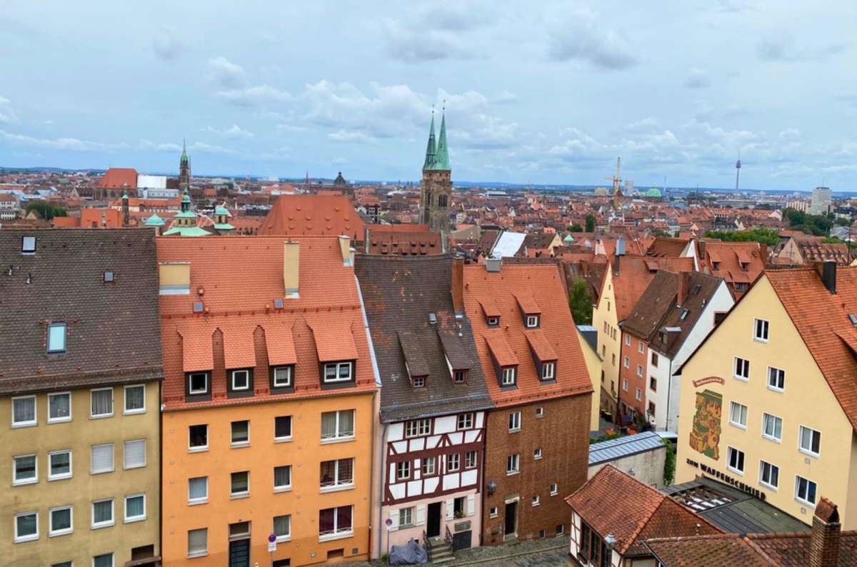 View over the medieval rooftops and church towers of Nuremberg Old Town from Nuremberg Castle, Germany, photo by Next Level of Travel