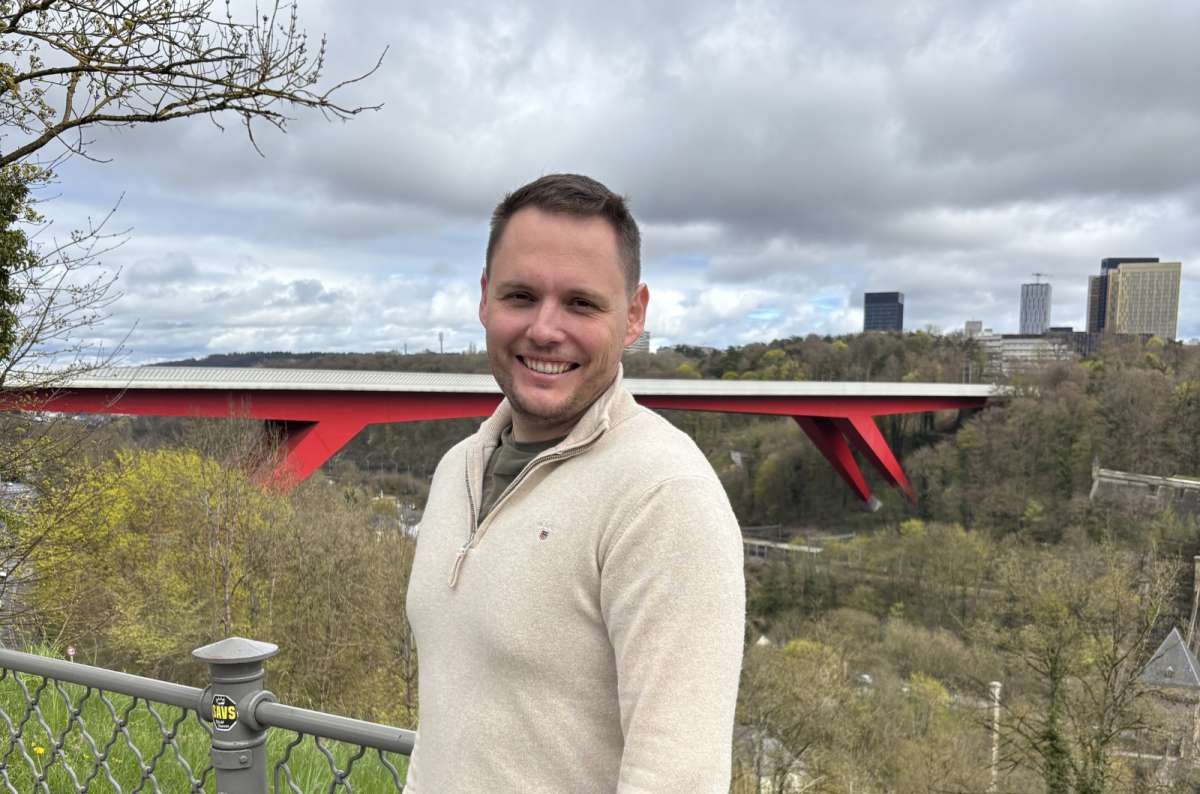 Tourist at the Grand Duchess Charlotte Bridge (Red Bridge) viewpoint, Luxembourg City, Luxembourg, photo by Next Level of Travel